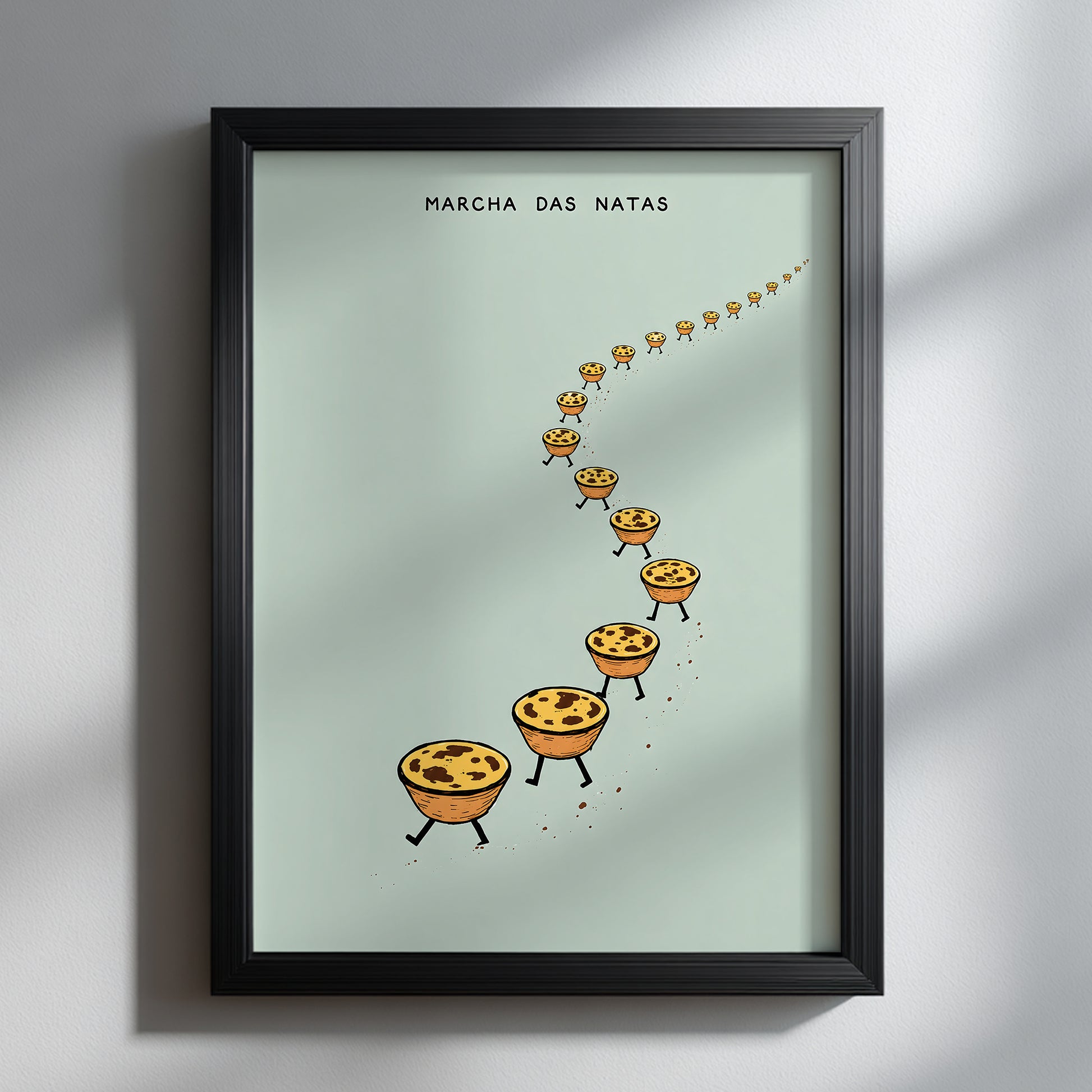 Funny pastel de nata poster in a black frame on a white wall, showing marching Portuguese custard tarts on a pale mint green background.