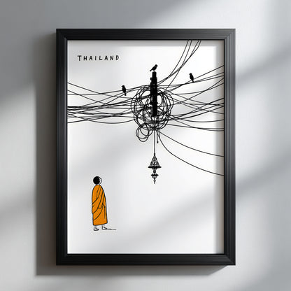 Black framed Thailand cable mess poster on a pale wall, showing a Buddhist monk in an orange robe beneath chaotic black overhead wires, small birds and a hanging Thai-style lamp. A clean, funny Thailand travel print with strong white space and modern cultural wall art style.