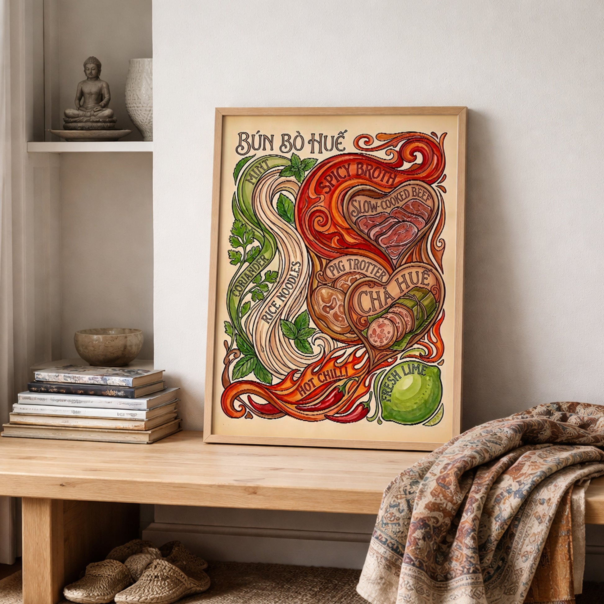 Bun Bo Hue poster styled on a shelf in a calm home setting with books, ceramics and soft textiles. The Vietnamese food print shows noodles, herbs, chilli, lime, beef and chả Huế sausage with hand-drawn details, suited to kitchen decor, dining rooms or a food-themed gallery wall.