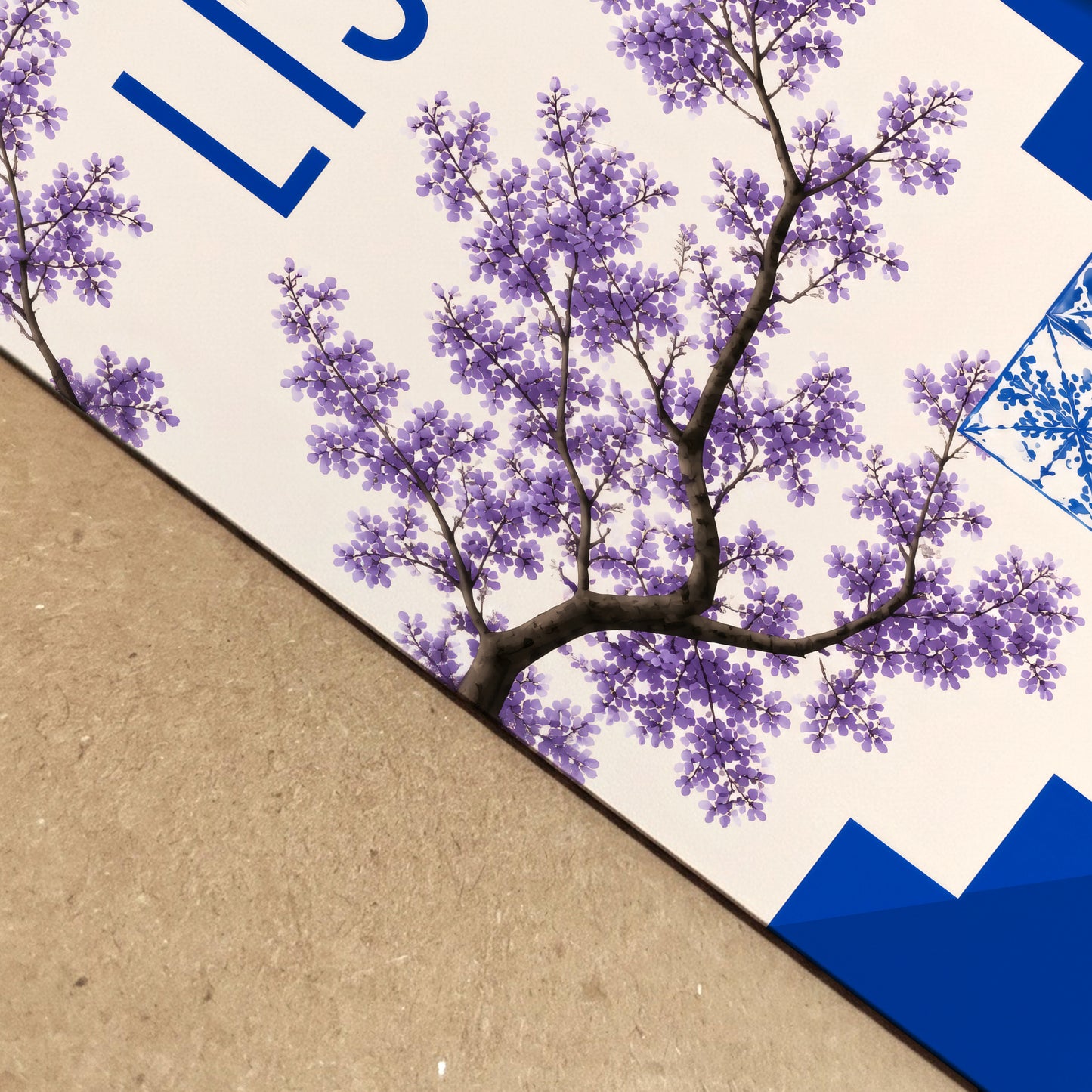 Real life close up of a Lisbon print showing paper texture, depth and sharp artwork detail. The image focuses on purple jacaranda flowers, blue geometric steps and part of the Portuguese tile pattern, giving a clear view of the print quality, colour contrast and Lisbon travel poster design.