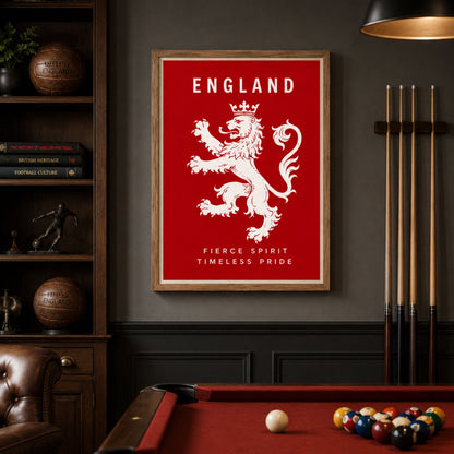 A framed England sports poster featuring a white lion rampant on a red background with the text 'ENGLAND' and 'FIERCE SPIRIT TIMELESS PRIDE', displayed on a dark wall above a pool table in a billiards room.