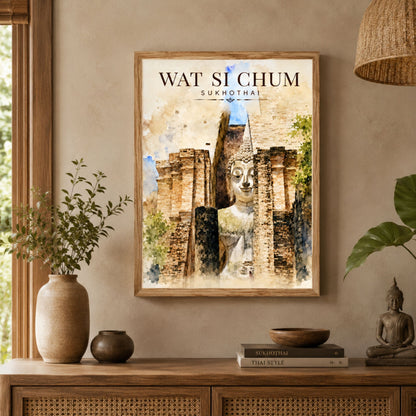 Wat Si Chum Sukhothai art print displayed in a warm neutral living room, featuring the seated Buddha framed by historic brick temple architecture in an earthy watercolour-style design.