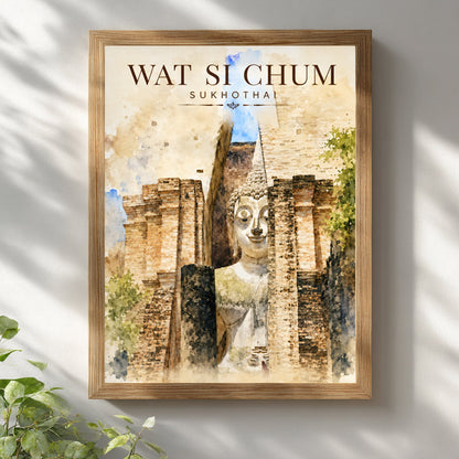 Wat Si Chum Sukhothai art print displayed in a natural wooden frame on a light wall, featuring the monumental Buddha, historic temple brickwork and warm watercolour-style tones.