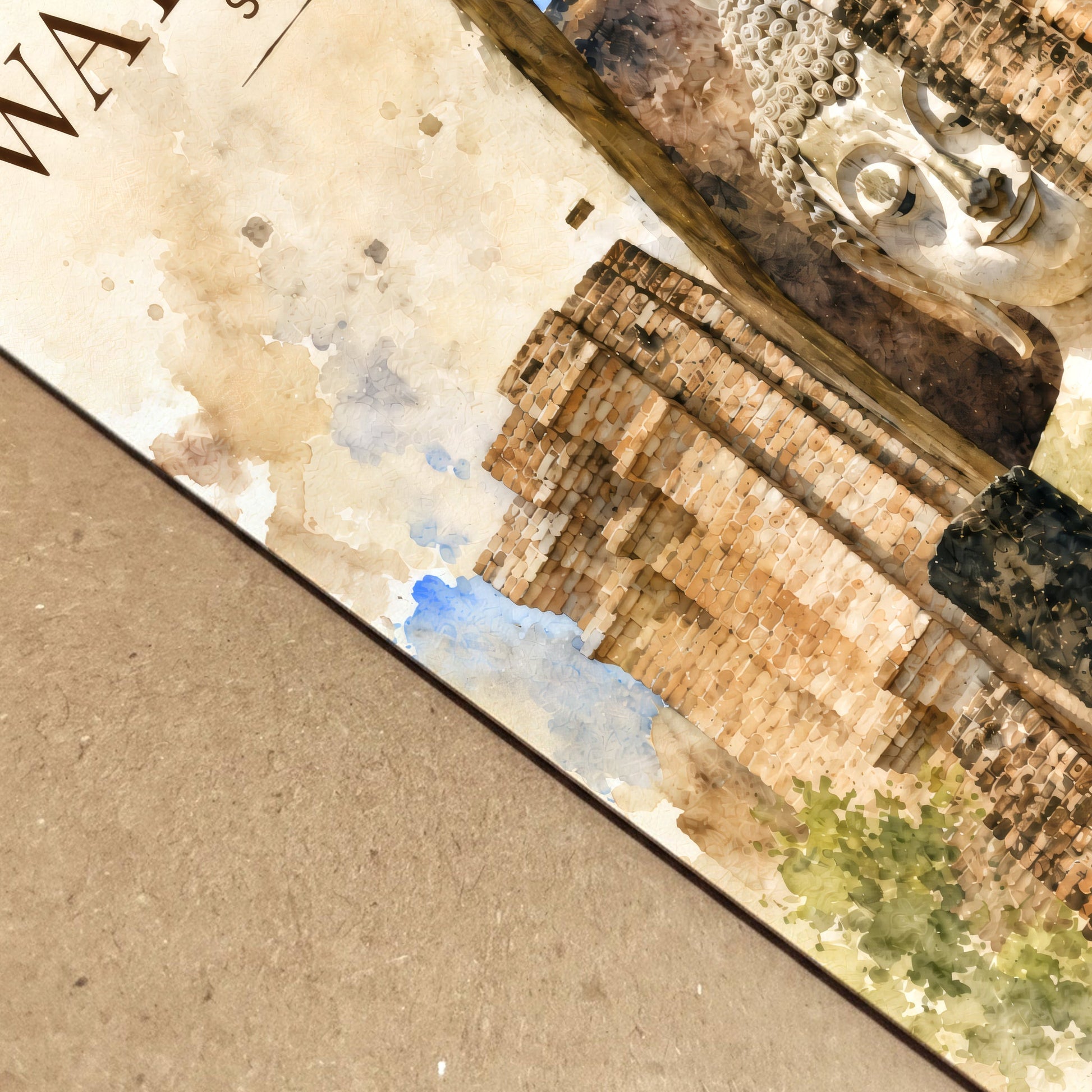 Close-up view of the Wat Si Chum watercolour art print showing detailed brick temple textures, warm sandstone colours and part of the seated Buddha design printed on paper.