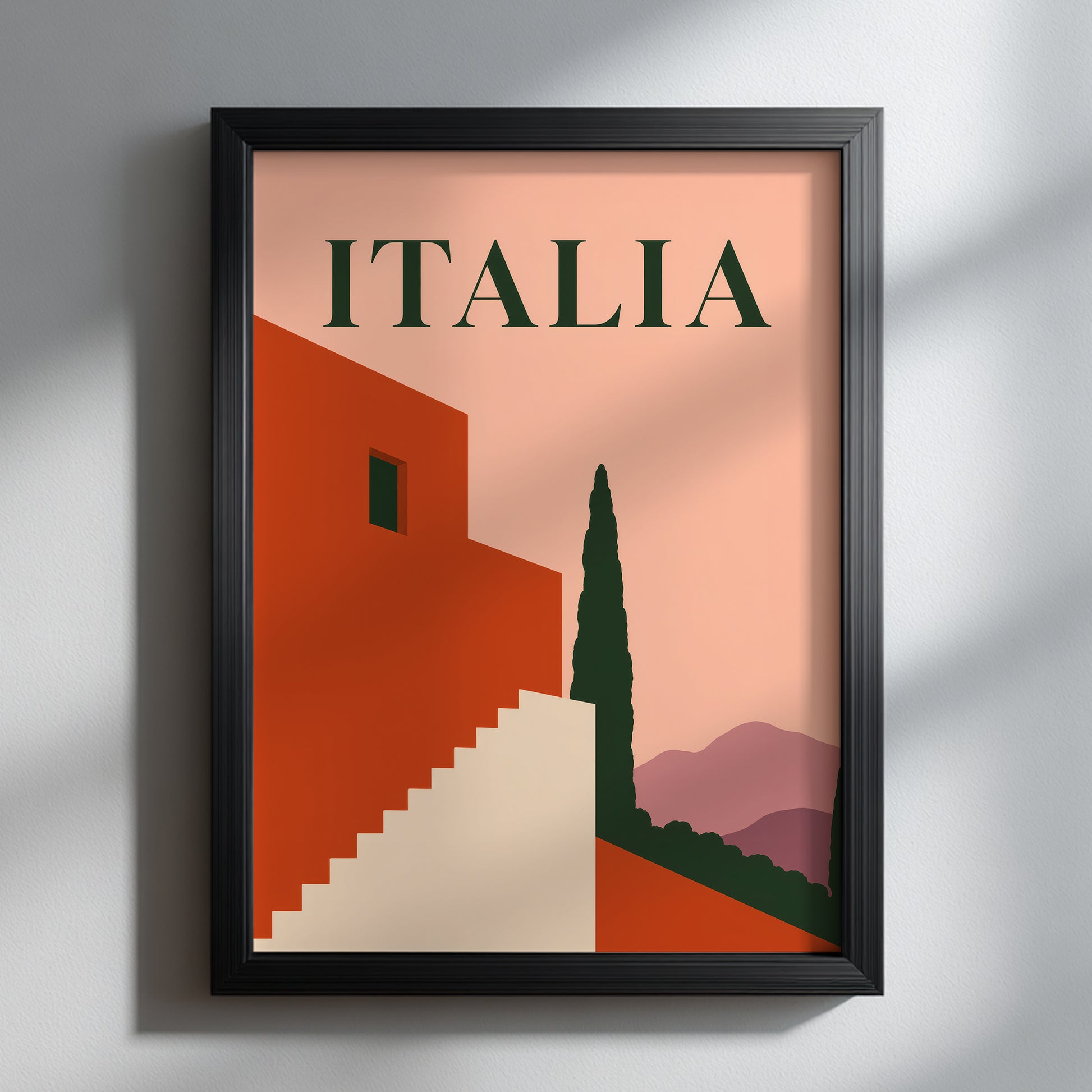 Italian travel print shown in a slim black frame on a light wall with soft natural shadows. The peach, terracotta, cream, dark green and mauve artwork features bold ITALIA typography, geometric Mediterranean architecture, a stepped staircase and a tall cypress tree for a clean mid-century modern display.