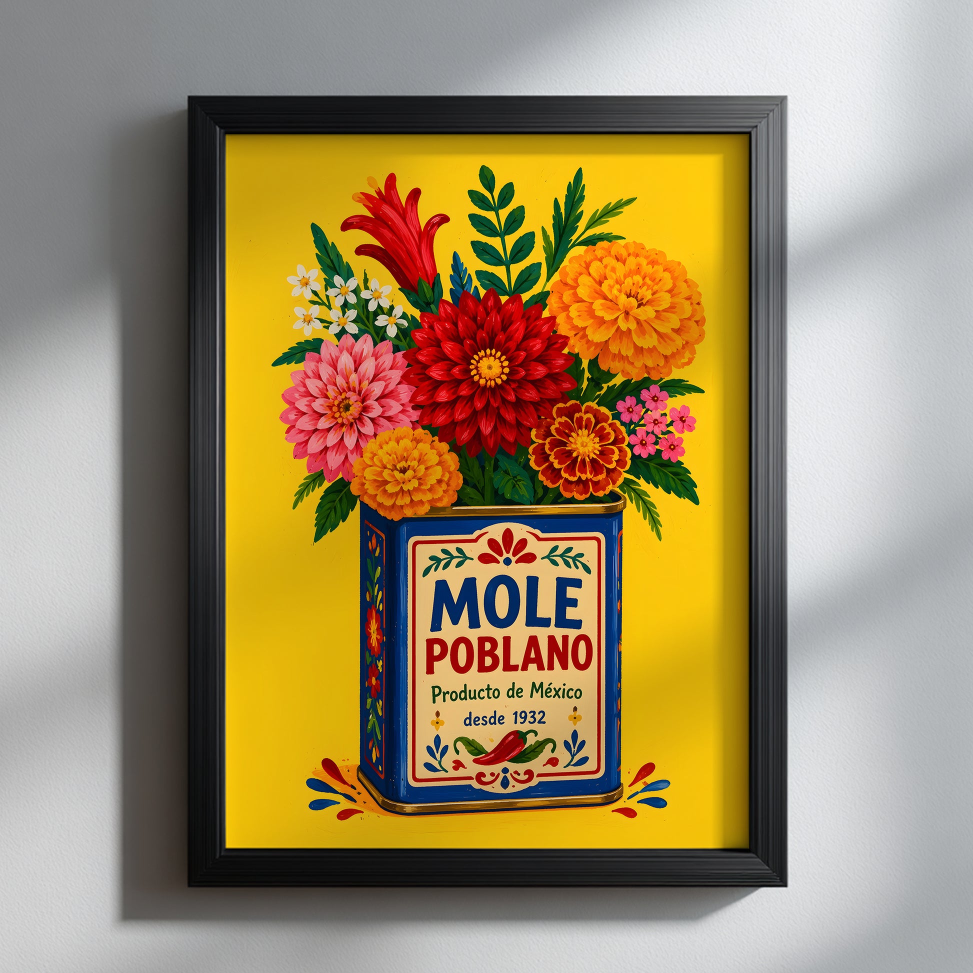 Mexican mole poblano wall art displayed in a slim black frame against a clean grey wall. The bright yellow print, blue vintage food tin and large red, pink and orange flowers stand out clearly, showing how this colourful Mexico poster can add strong contrast to a modern kitchen, dining room or gallery wall.