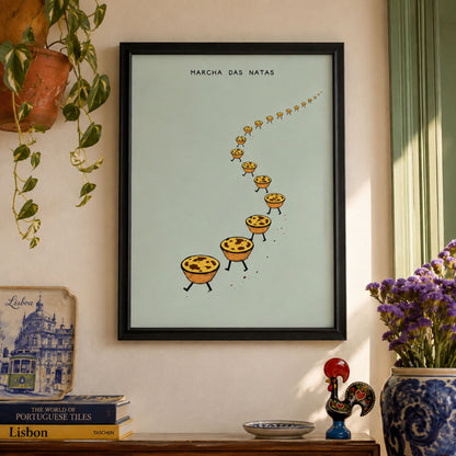 Pastel de nata wall art in a black frame displayed in a colourful lived-in interior with plants, flowers and decorative objects around the Portuguese food print.