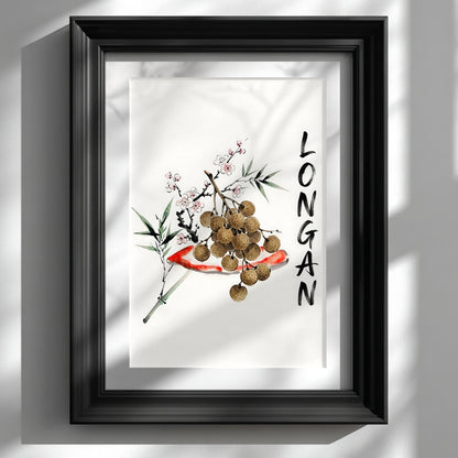 Black framed wall art print showing a minimalist Thai longan watercolour on a white wall. The artwork has brown longan fruit, green bamboo-style leaves, small blossom details and vertical black lettering, styled as Southeast Asia inspired fruit decor for kitchens, dining rooms or calm home interiors.