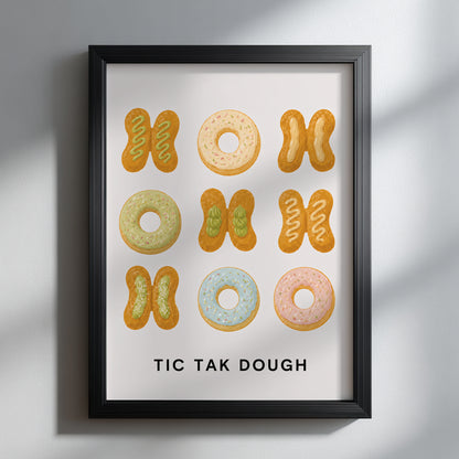Thai patongo and pastel doughnut kitchen print in a black frame on a light grey wall, with soft diagonal sunlight highlighting the funny TIC TAK DOUGH food artwork.