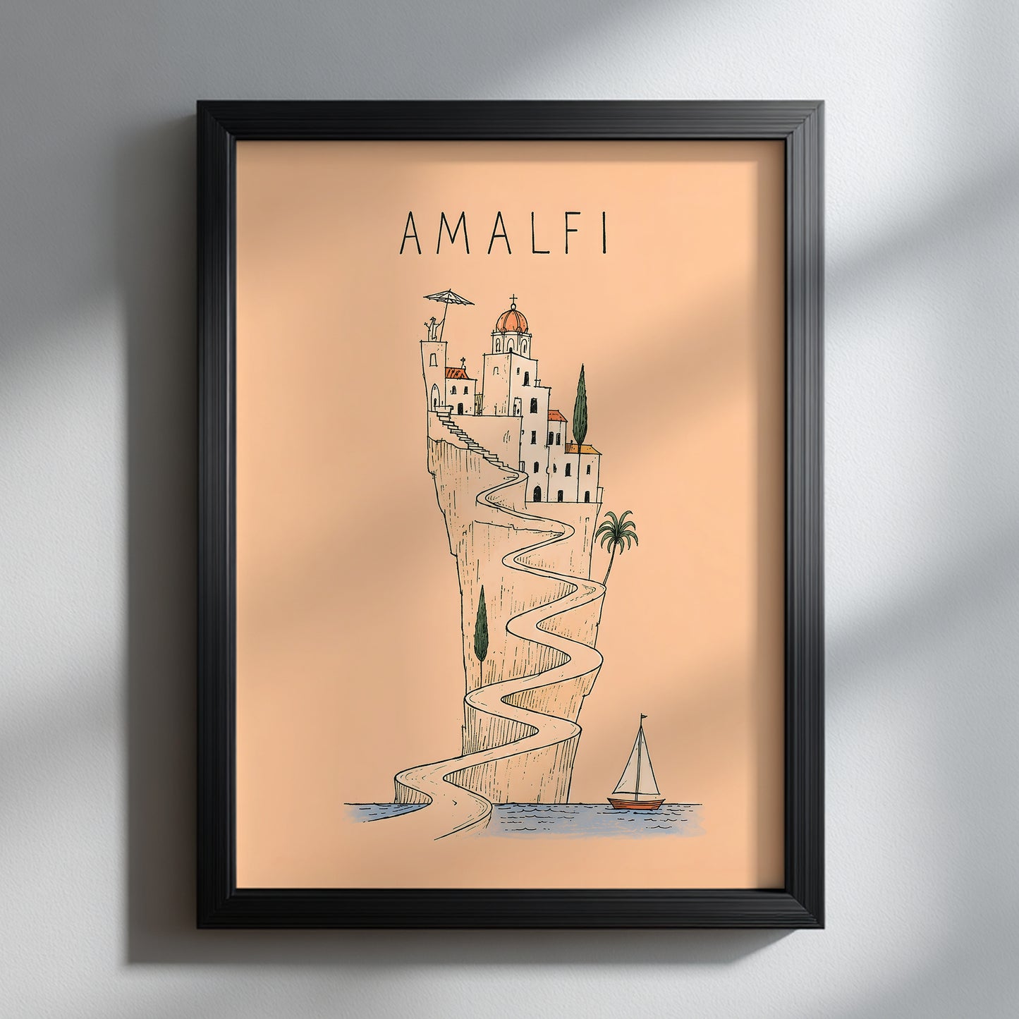 Amalfi Coast line art print displayed in a black portrait frame on a white textured wall, with natural sunlight and soft shadows highlighting the peach artwork.
