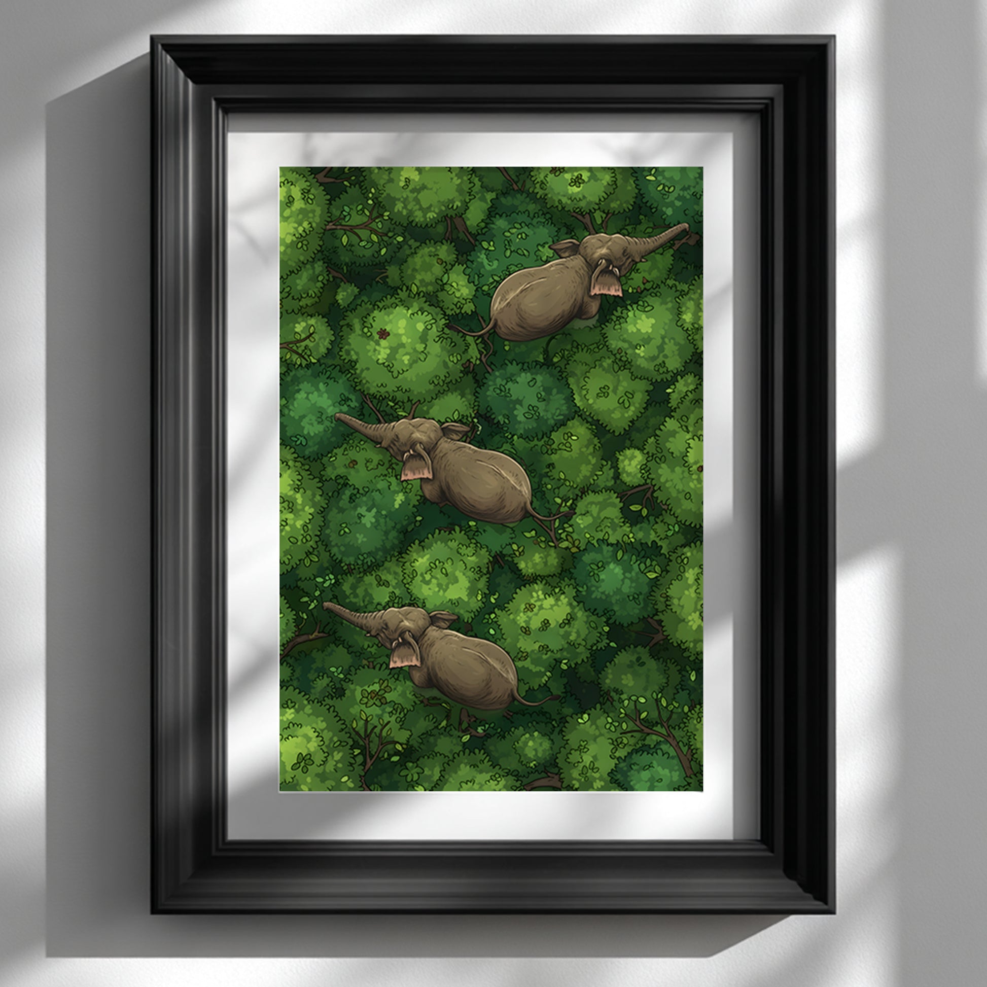 Black framed elephant wall art mockup shown on a white wall with soft window light and shadow. The artwork shows three elephants moving diagonally through dense green jungle treetops from an overhead view, creating a calm travel-inspired nature scene. Styled as modern jungle wall decor, elephant poster art, green animal print and tropical wildlife wall art for contemporary interiors.
