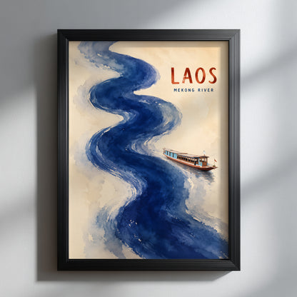 Laos Mekong River wall art shown in a slim black frame against a soft grey wall, with natural side lighting and gentle shadows. The cream poster features a flowing blue watercolour river, a small traditional boat and red LAOS lettering. Clean, modern travel wall art suited to neutral and contemporary interiors.