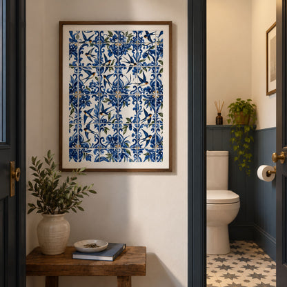 Black framed Portuguese andorinha azulejo print displayed in a warm interior, combining blue and white patterned tiles, floral decoration and flying swallows.