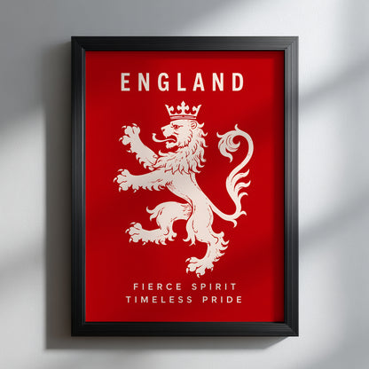 Black framed England lion poster on a light wall, with a cream crowned heraldic lion, ENGLAND lettering and pride slogan against a bold red background.