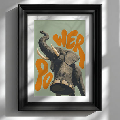 Black framed elephant wall art shown on a clean white wall, featuring a grey elephant with raised trunk, large tusks, soft green background and bold orange retro lettering. A strong safari animal poster for modern living room decor, hallway styling, office wall art or animal lover home decor.