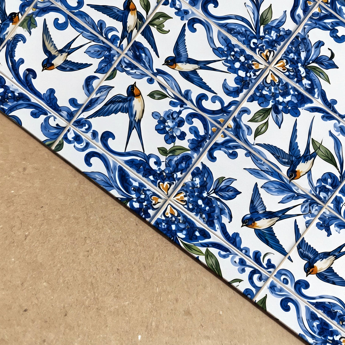 Close-up of the Portuguese swallow azulejo print showing detailed blue and white tile patterns, floral decoration, flying andorinha birds and the edge of the printed artwork
