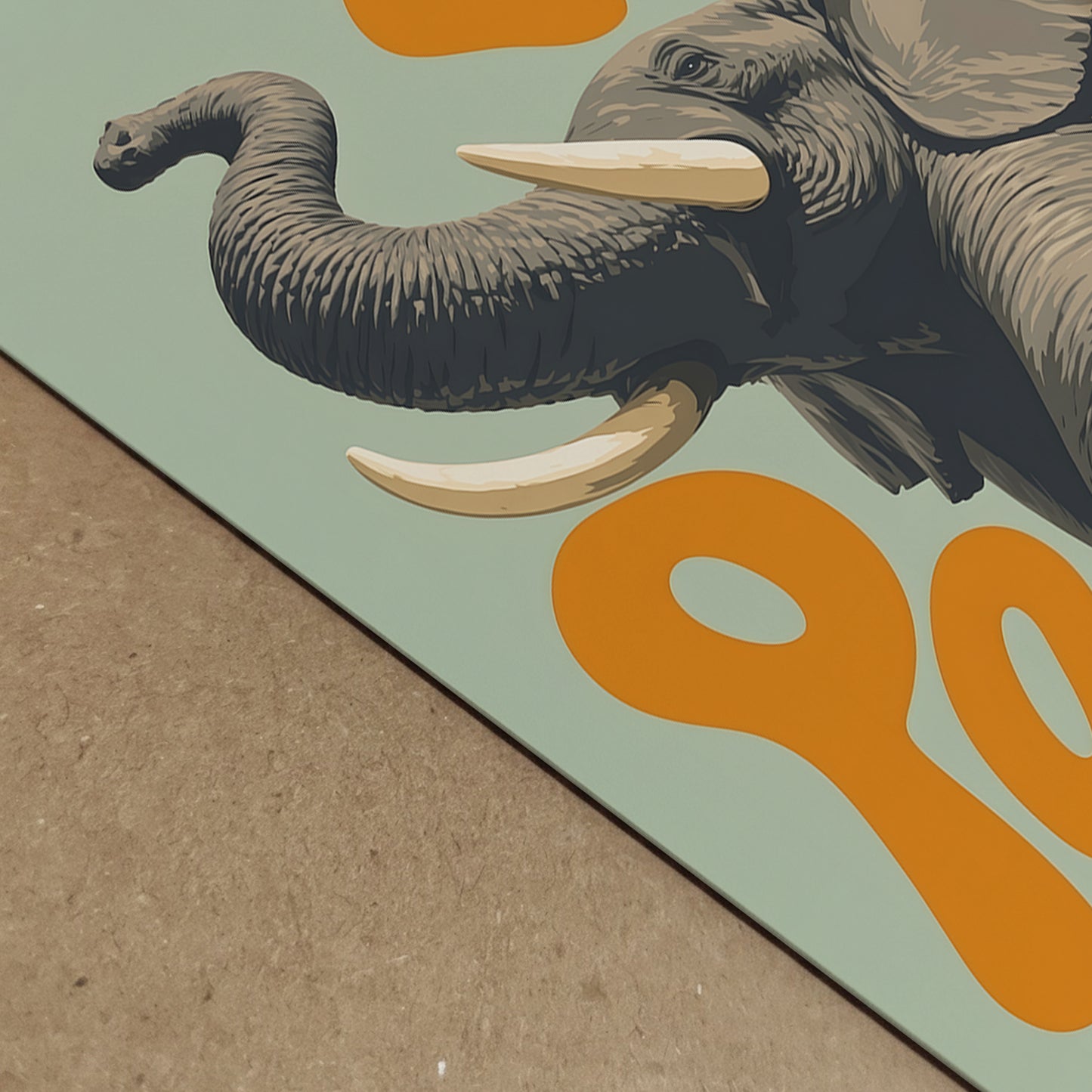 Close-up detail of an elephant art print showing the raised trunk, grey skin texture, large tusk and bold orange lettering on a soft green background. A colourful animal poster with retro safari style, ideal for showing print detail, playful wall decor, African wildlife art and modern elephant home decor.