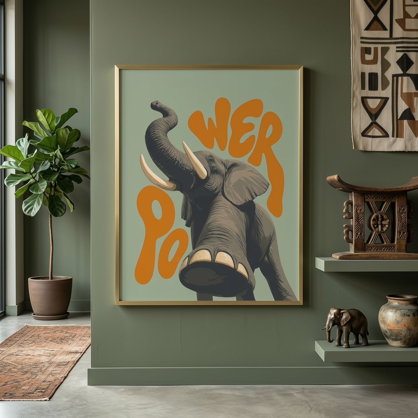 Framed elephant poster displayed on a green wall with plants, shelves and natural home decor. The design features a grey elephant with raised trunk, large tusks and bold orange retro lettering, creating playful safari wall art for living rooms, hallways, offices, kids’ rooms or colourful animal print styling.