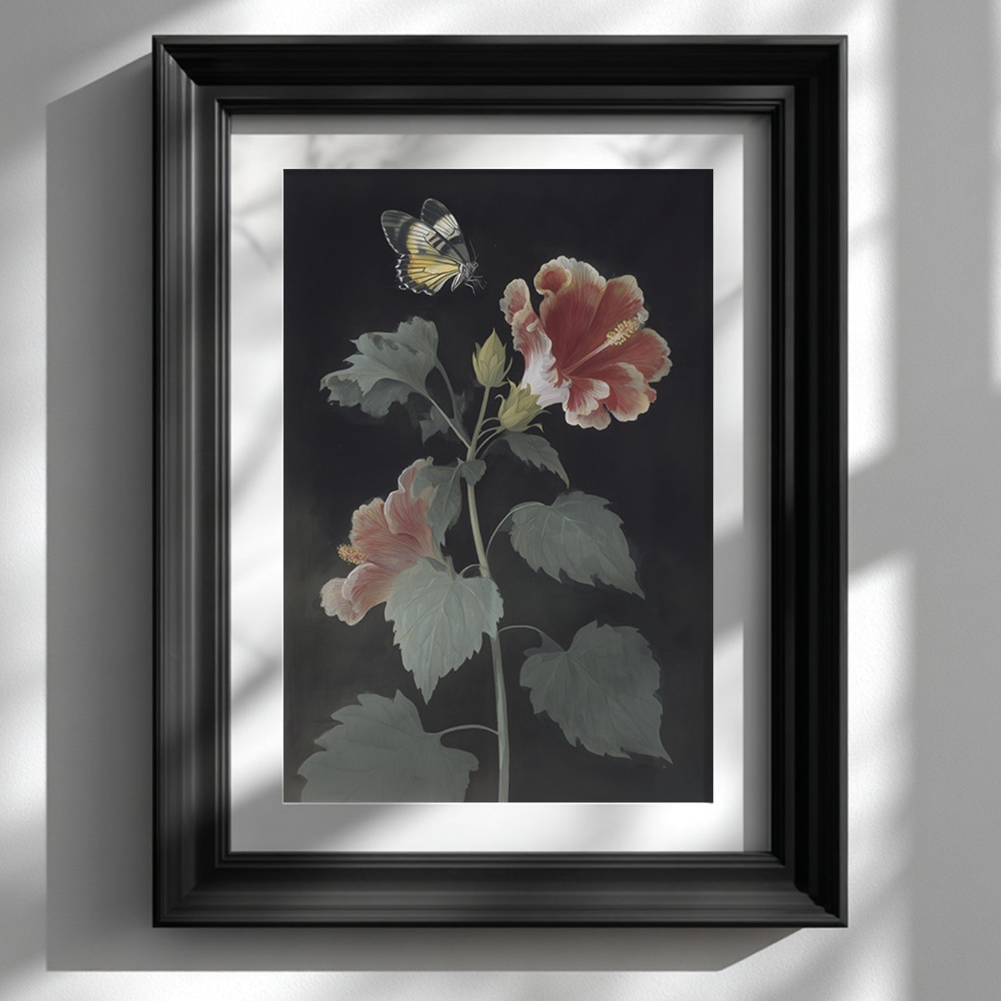 Framed Malaysian hibiscus and Rajah Brooke’s Birdwing butterfly wall art displayed on a clean white wall in a black frame. The botanical print shows a tall hibiscus plant with red and pink petals and a yellow butterfly above the flower, creating a vintage botanical wall art look with strong contrast and minimal styling.