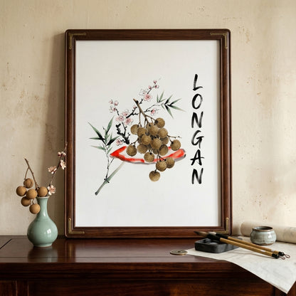 Framed longan watercolour print displayed on a mantel with neutral home decor. The artwork shows Thai longan fruit, bamboo-style leaves, blossom accents and vertical black lettering on a clean white background, making it a minimalist Southeast Asia fruit poster for kitchens, living rooms or dining areas.