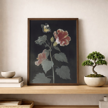Malaysian hibiscus botanical poster placed on a wooden shelf beside a small bonsai tree and books. The artwork shows Bunga Raya flowers with red and pink petals and a Rajah Brooke’s Birdwing butterfly above. Tropical botanical wall art with a vintage feel styled in a minimal, nature-inspired shelf display.
