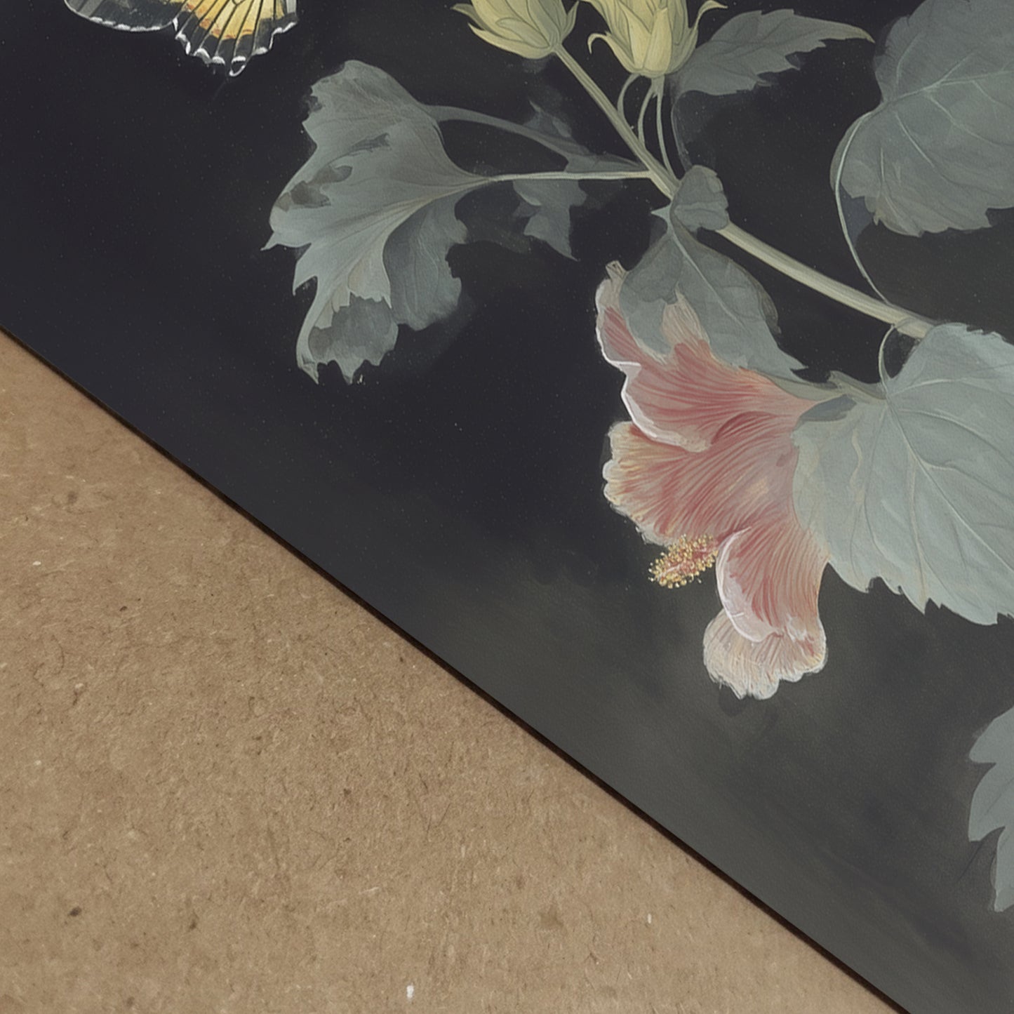 Close-up detail of Malaysian hibiscus botanical print showing paper texture and fine illustration lines. The Bunga Raya petals and green leaves are visible against the dark background, highlighting print quality and colour depth. Macro view of botanical flower print with vintage natural history style.