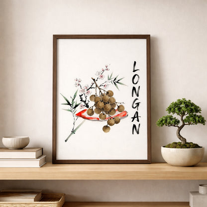 Framed Thai longan watercolour poster styled on a shelf beside a small bonsai plant and simple home decor. The print shows brown longan fruit, soft green leaves, pale blossoms and black vertical lettering, suited to minimalist kitchen wall art, dining room styling or Southeast Asia inspired interiors.