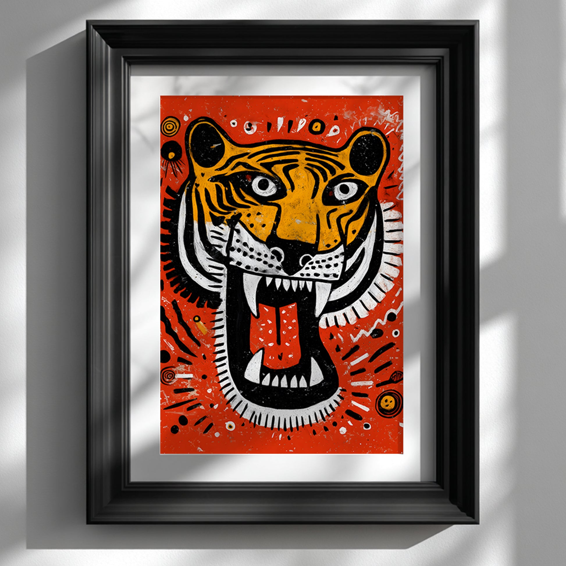 Framed Roaring Malayan Tiger poster displayed in a sleek black frame against a clean white wall. The artwork features a bold orange background with a sketch-style tiger head, open mouth, sharp white teeth and red tongue. High contrast black and white stripes and tribal-style circular accents create a striking modern wildlife wall art statement piece for contemporary interiors.