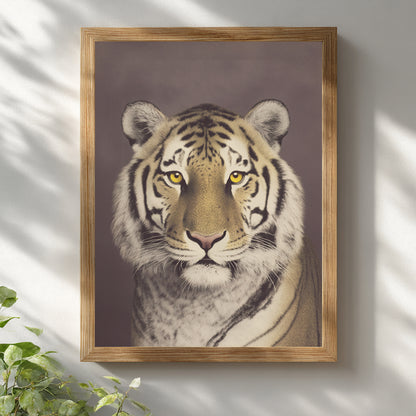Malayan tiger wall art displayed in a natural wooden frame against a white wall. The close-up wildlife portrait features a focused gaze, strong stripe contrast and muted brown background. Vintage photographic style animal print designed for modern home decor, office spaces or neutral interior settings.