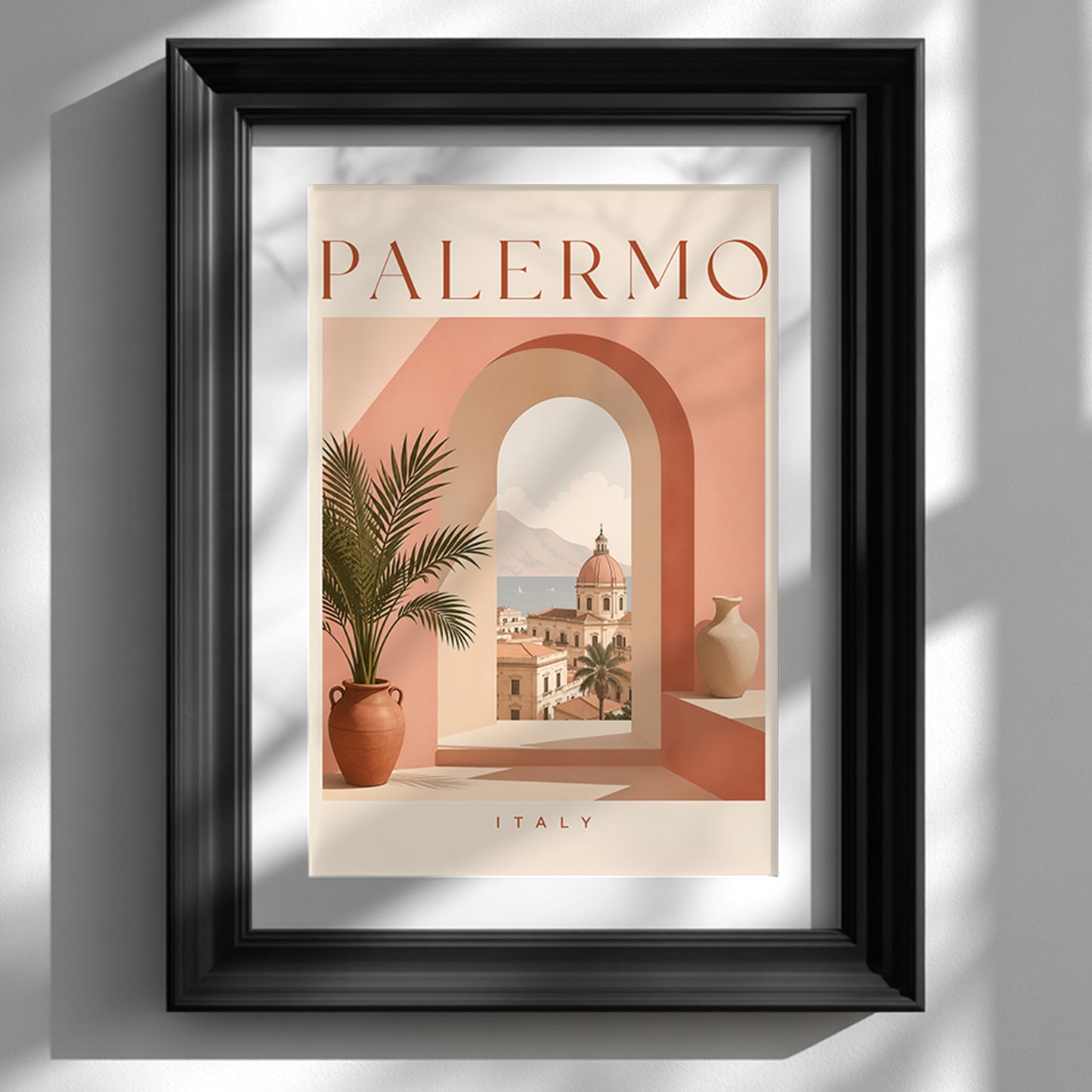 Palermo Italy travel poster displayed in a deep black frame against a clean white wall. The artwork features a warm peach and terracotta archway, a potted palm and a sunlit Sicilian city view, with PALERMO typography above. Strong side shadows give this Mediterranean wall art mock-up a modern, gallery-style finish.