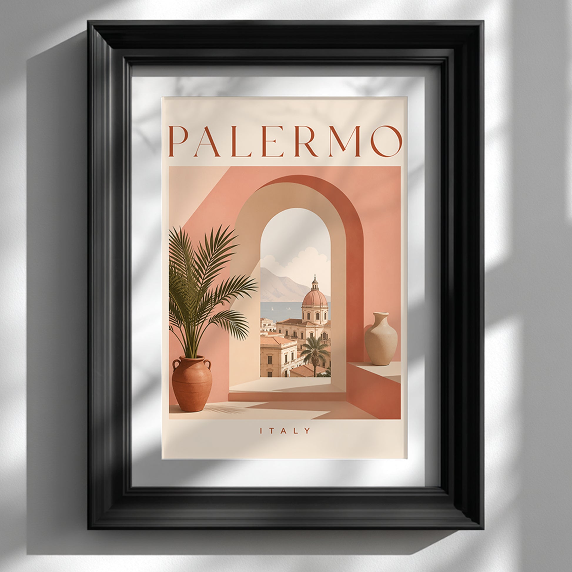 Palermo Italy travel poster displayed in a deep black frame against a clean white wall. The artwork features a warm peach and terracotta archway, a potted palm and a sunlit Sicilian city view, with PALERMO typography above. Strong side shadows give this Mediterranean wall art mock-up a modern, gallery-style finish.