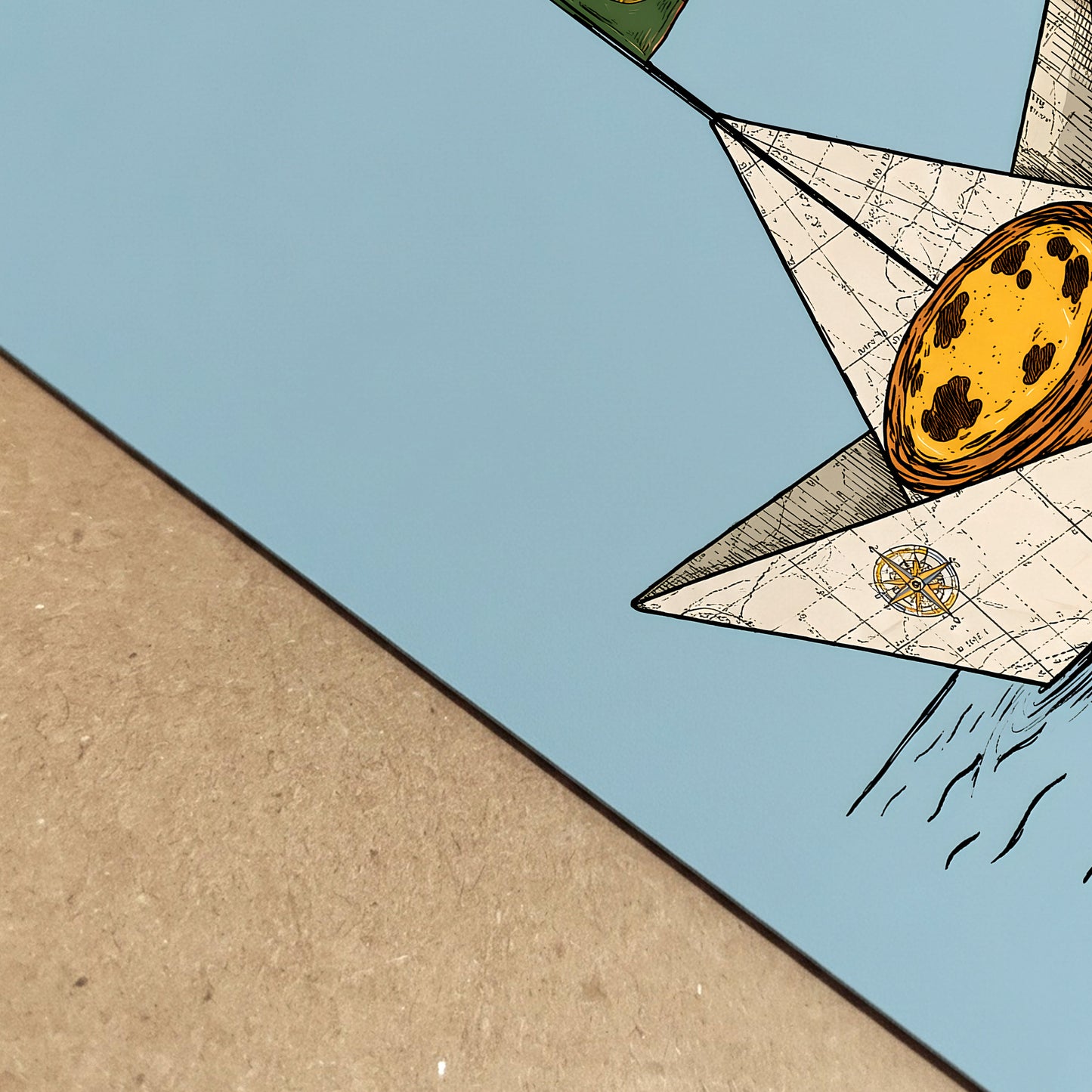 Close-up of the pastel de nata art print showing the soft blue background, map-patterned paper boat, golden custard tart and printed paper texture.