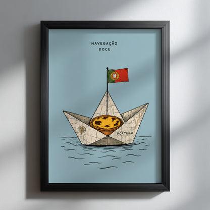 Portuguese pastel de nata sailing boat print displayed in a black frame on a pale wall with soft natural shadows.