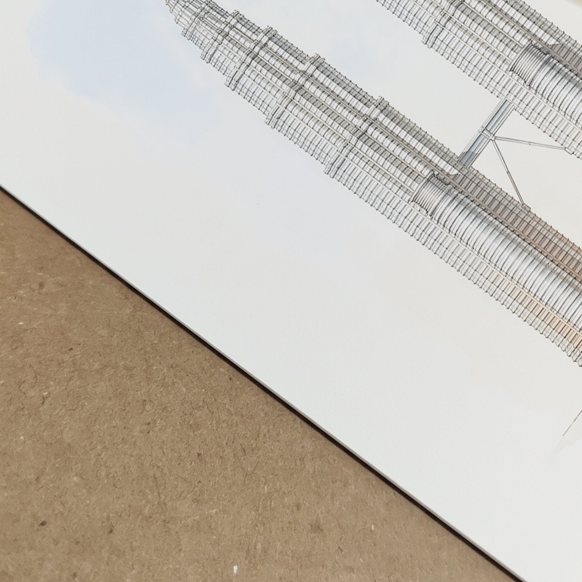 Close-up view of the Petronas Towers architectural line art print showing fine structural lines and detailed skyscraper illustration. The image highlights the texture of the archival paper and crisp print quality, emphasising the precise Kuala Lumpur Twin Towers drawing used in minimalist Malaysia architecture poster design.