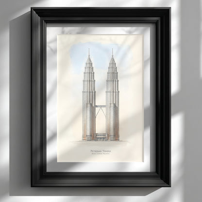 Framed Petronas Towers architectural line art print displayed in a black frame on a bright white wall. The illustration shows the Kuala Lumpur Petronas Twin Towers standing symmetrically with the connecting sky bridge and soft sky tones behind. Minimalist Malaysia architecture wall art featuring detailed skyscraper line work and neutral colours suited for modern interior decor.