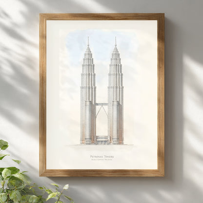 Petronas Towers architectural line illustration framed in a light wooden frame on a white wall. The minimalist Kuala Lumpur skyline artwork shows the iconic Twin Towers connected by the sky bridge with precise structural line work and neutral tones, creating modern Malaysia architecture wall art for contemporary interiors.