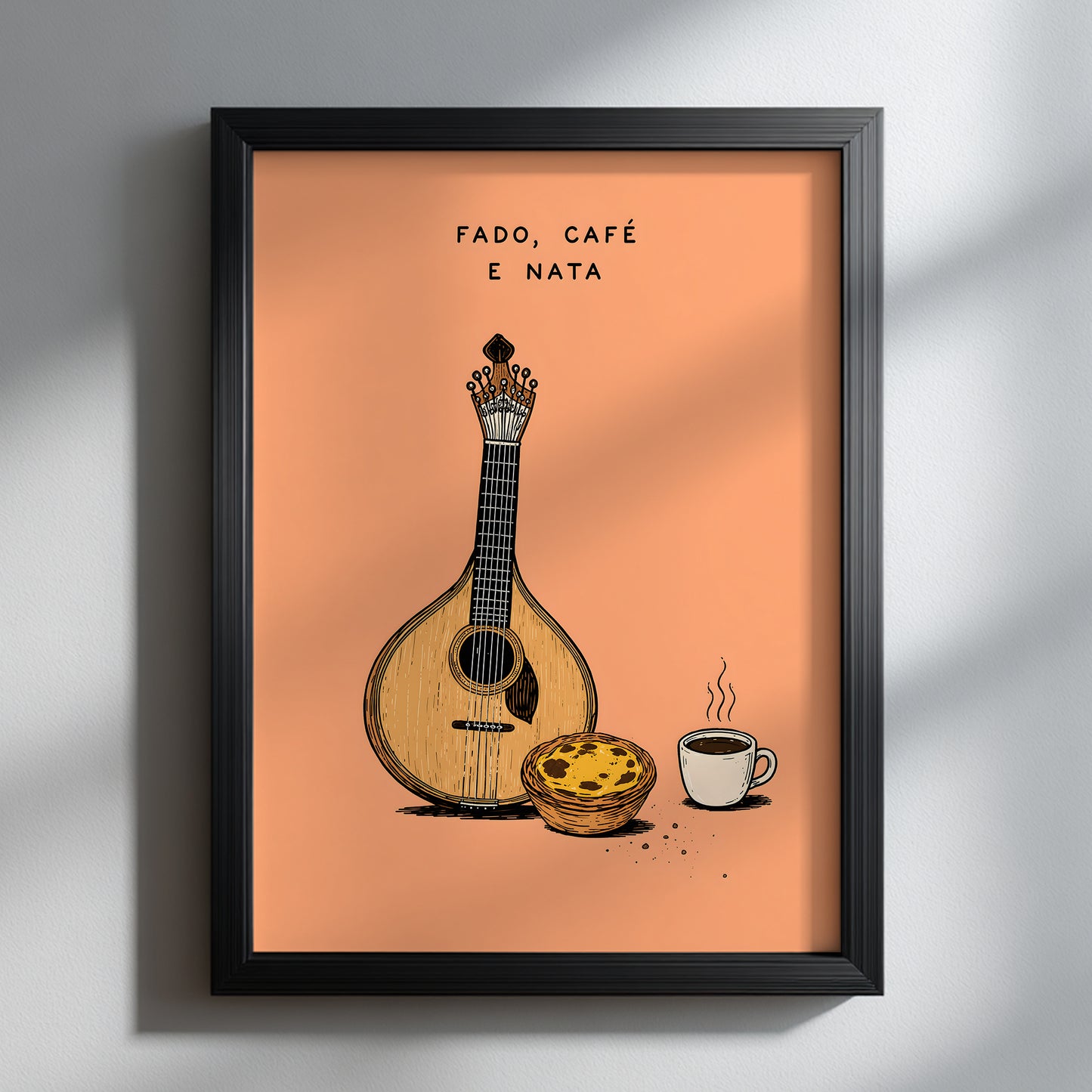 Portuguese fado art print in a black frame on a white wall, showing a Portuguese guitar, pastel de nata and coffee cup on a peach background beneath Fado, Café e Nata text.