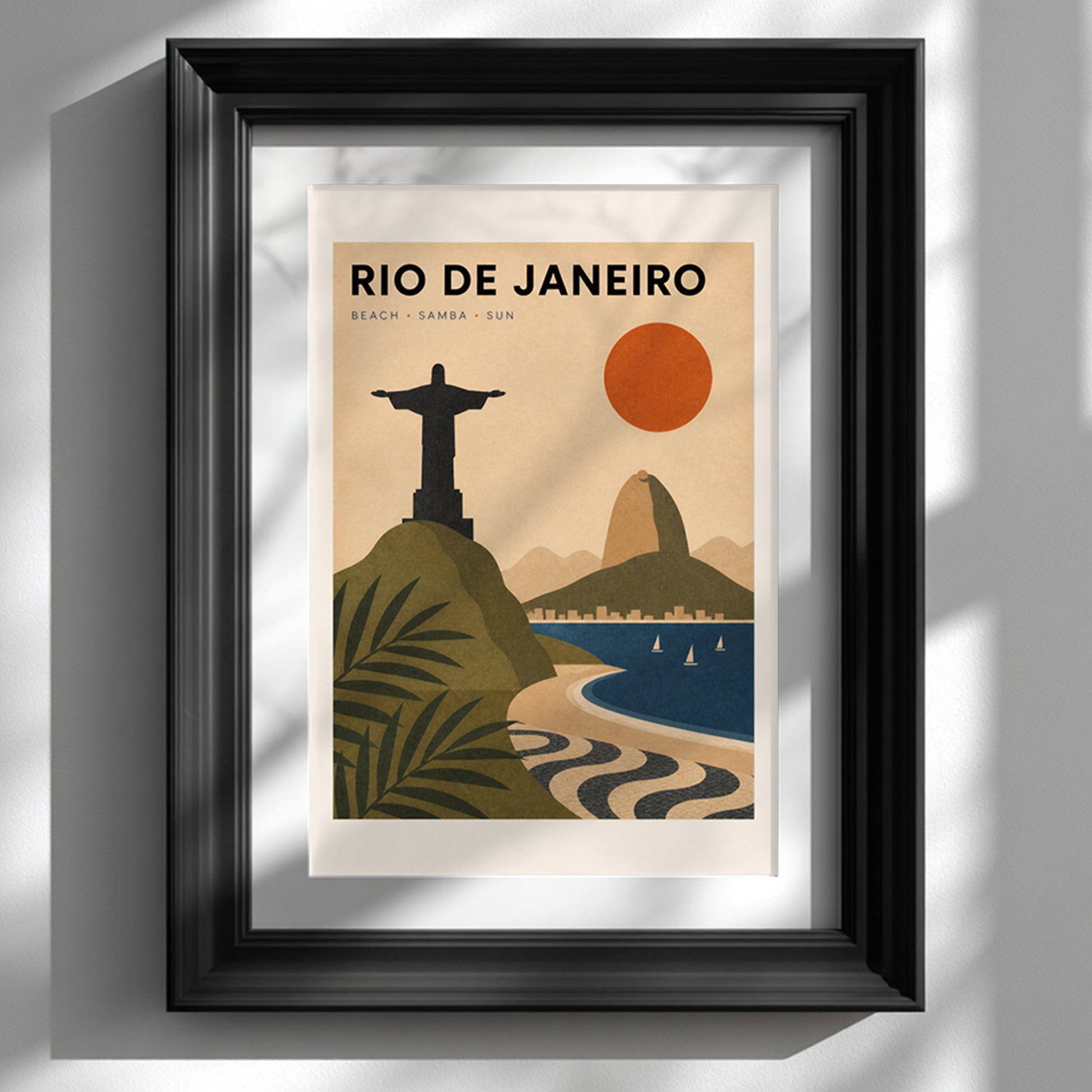 Rio de Janeiro travel poster displayed in a slim black frame against a clean white wall. The vintage-style Brazil wall art features Christ the Redeemer, Sugarloaf Mountain, Copacabana Beach, tropical leaves, blue sea and the famous black-and-white wave pavement in warm retro colours.