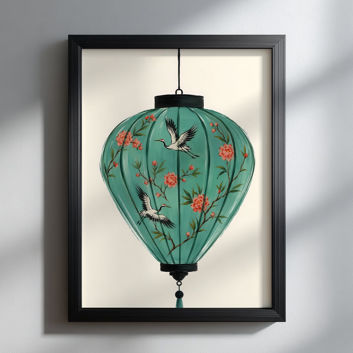 Turquoise Vietnamese Hoi An lantern art print in a black frame on a pale wall, featuring red blossom branches and flying crane motifs on a warm cream background.