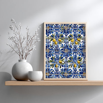 Wood-framed Portuguese blue azulejo olive print displayed on a shelf against a pale grey wall, styled beside white ceramic vases and dried branches.