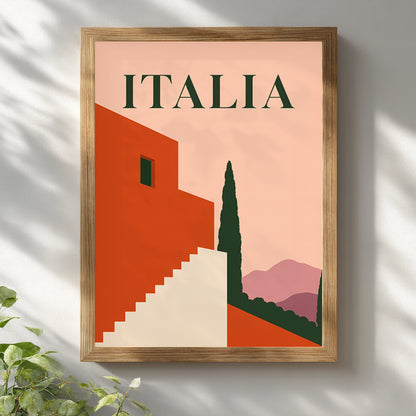 Italia mid-century travel print in a light wooden frame on a white wall, lit by soft window shadows with green leaves visible below. The artwork features a peach background, terracotta architecture, cream steps, dark green cypress tree and mauve hills, creating warm Italian wall decor for bright modern interiors.